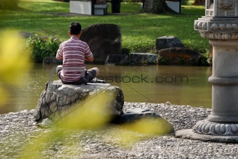 man, yoga and pond in the park