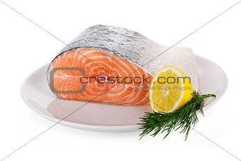 Raw steak of salmon on white plate isolated