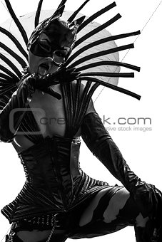 woman in catwoman leather latex fetish wear  silhouette