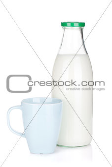 Cup of milk and glass bottle