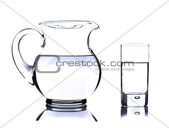 Glass jug and tumbler with water on white