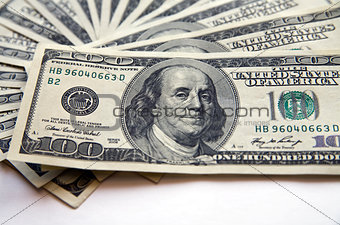 pile of dollar banknotes on a white background
