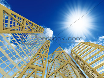 High modern skyscrapers on a background of the blue sky and in solar patches of light