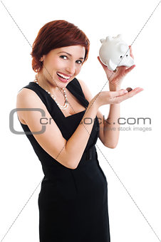 beautiful young woman with piggy bank against white background