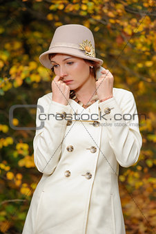 attractive woman in evening autumn park
