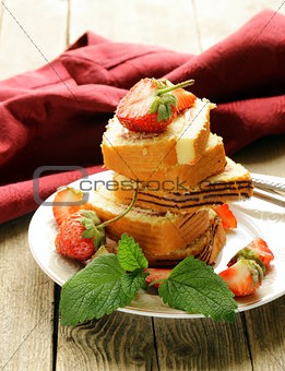 roulade cake with cream and strawberries