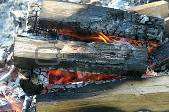 Flame with embers outdoors photo