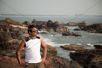 Happy indian man with sunglasses