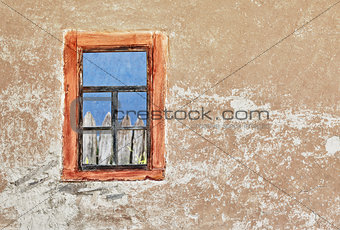 Wall of old ukrainian house with a window