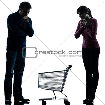 couple woman man sad with empty shopping cart silhouette