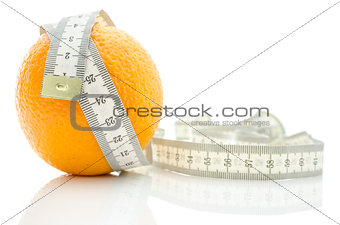 Orange fruit wrapped with measuring tape 