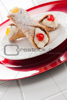 Two Tasty Cannoli on Plate
