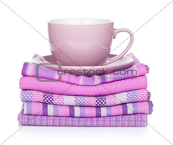 Coffee cup over kitchen towels