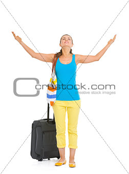 Full length portrait of young tourist woman with wheel bag enjoy