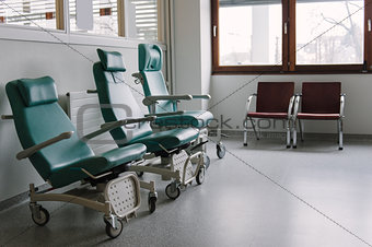 Empty chairs in a hospital.
