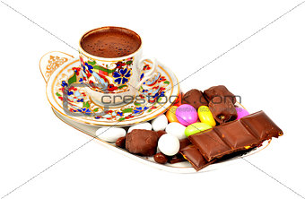 a cup of Turkish coffee with chocolate, on white background