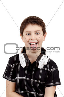 Young boy grinning and show tongue with headphones