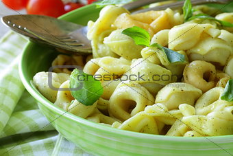 Italian tortellini with basil and olive oil