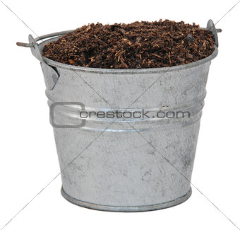 Compost / soil / dirt in a miniature metal bucket