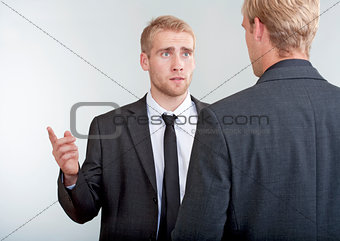 two businessmen discussing