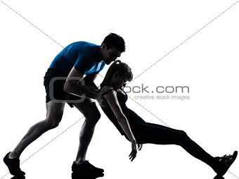 aerobics intstructor  with mature woman exercising