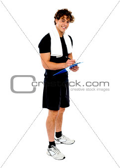Full length portrait of male fitness trainer