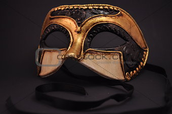 mask on dark background