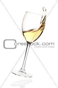 Splashing white wine in a falling glass