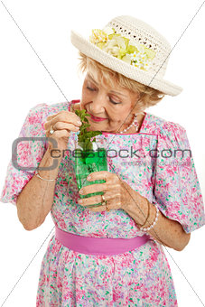 Tipsy Senior Lady Drinking Cocktail
