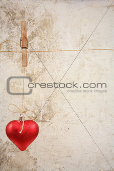 eart as a symbol of love/vintage card with red heart on Grunge vintage love/valentine background
