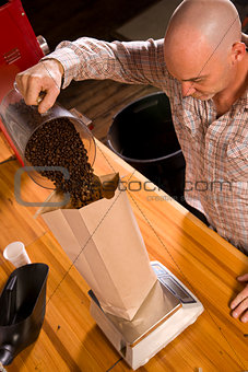Roaster Owner Does Work of Coffee Packing Bagging