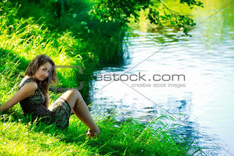 woman sitting on shore