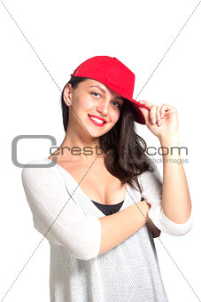 Attractive young woman wearing a red baseball cap
