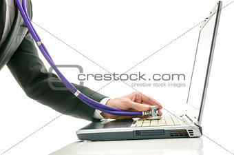 Side view of male hand checking laptop with stethoscope