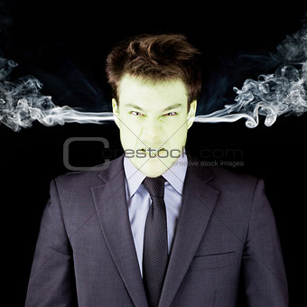 Furious businessman getting green face