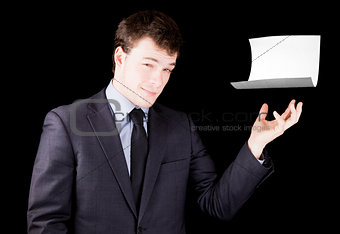 Businessman presenting a blank sheet of paper with room for text