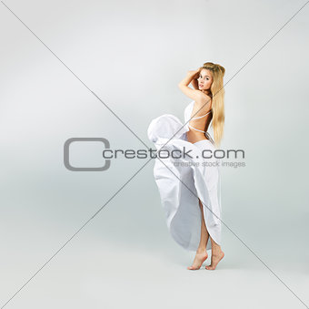 Blonde Woman in Waving White Dress
