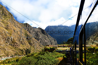 Peruvian train and ancient buildings