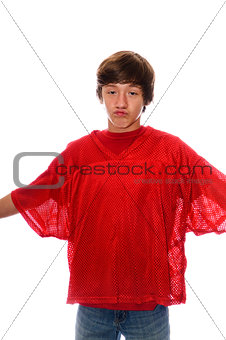 Young teen boy in red jersey isolated on white