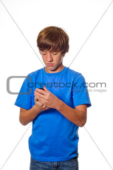 Young teen boy looking at cell phone