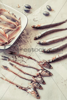 Raw anchovies on paper