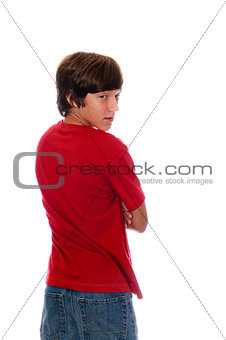 Young teen boy looking backward on white