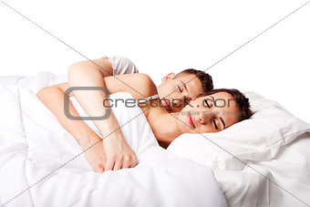 Couple happy asleep in bed