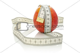 Apple wrapped with measuring tape