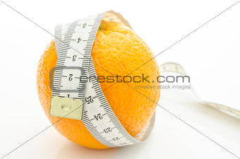 Orange with measuring tape wrapped around it