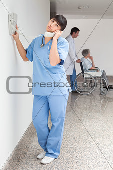 Nurse using telephone