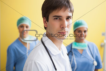 Doctor with two smiling nurses