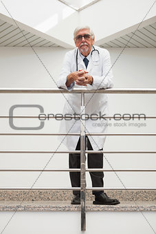 Doctor leaning on the railing