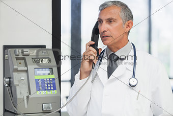 Doctor on a payphone