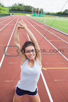 Happy woman stretching her arms